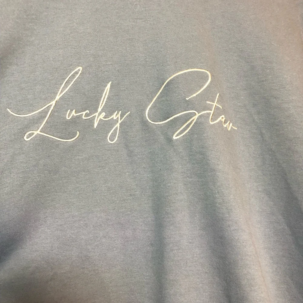 Blue Lucky Star Sweatshirt with Silver Star Accents